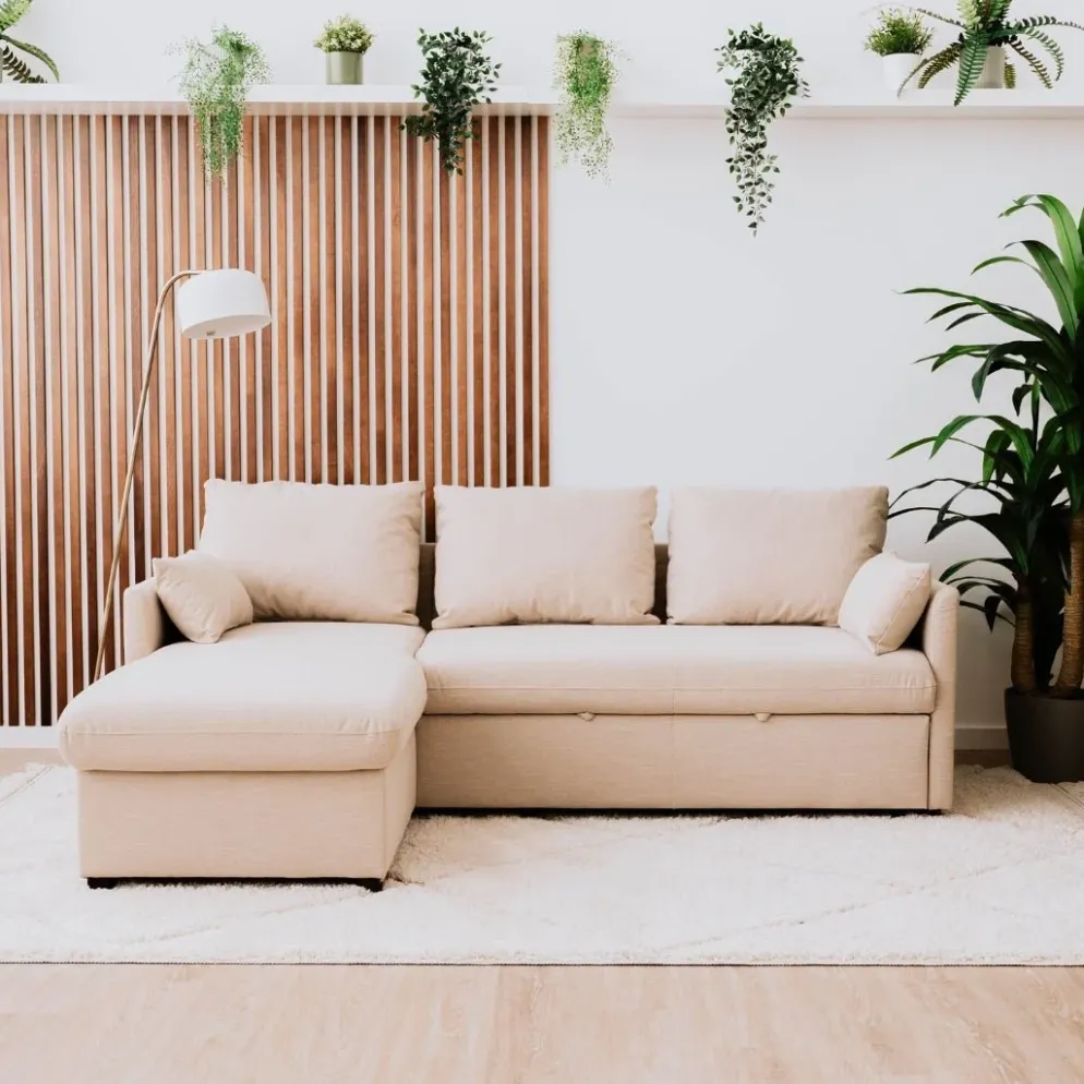 Sofá cama com chaise longue reversível, arrumação e almofadas decorativas